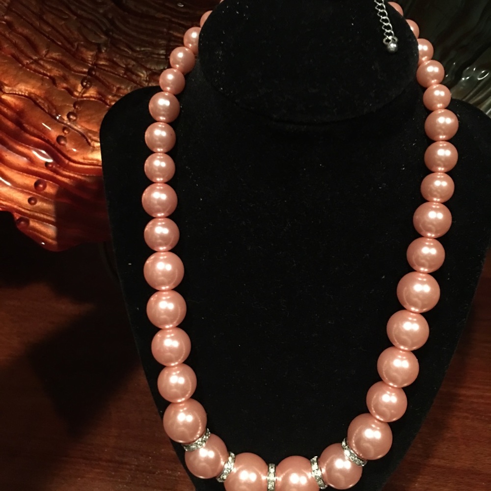 Gorgeous pink will compliment a black dress.